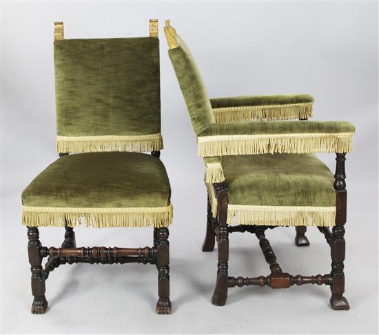 A set of ten late 17th century style carved oak dining chairs including two carvers, H. 3ft 7in.